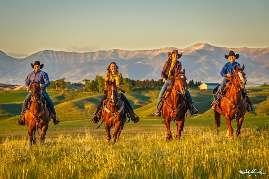 family riding horses